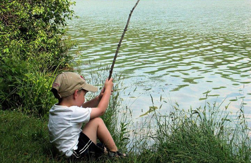 Kid fishing at Wilderness Resort Villas.
