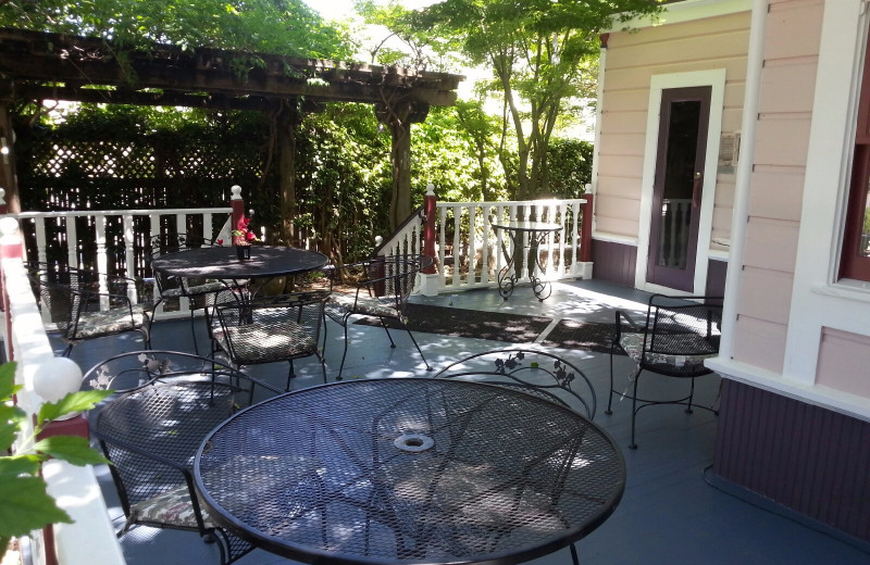 Patio under the trees at Hennessey House Bed & Breakfast.