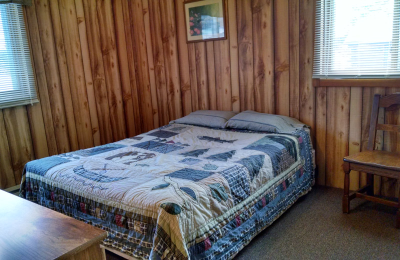 Cabin bedroom at The Arrows Resort.