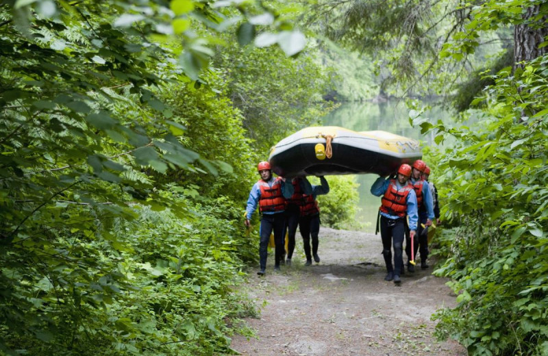 Group carrying raft at REO Rafting Resort.