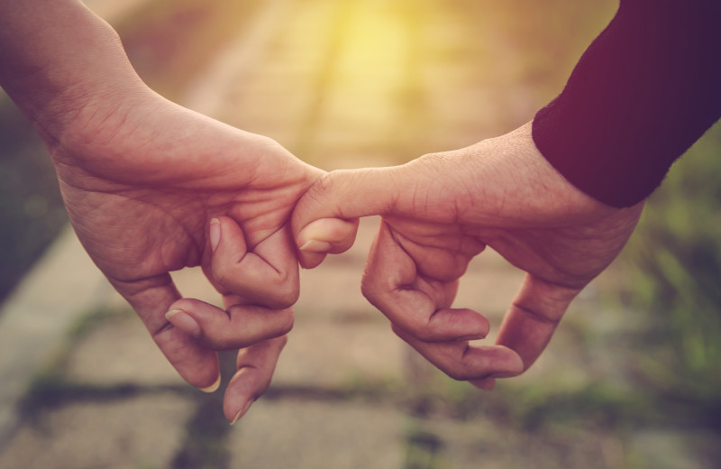 Couple holding hands at Natural Retreats Park City.