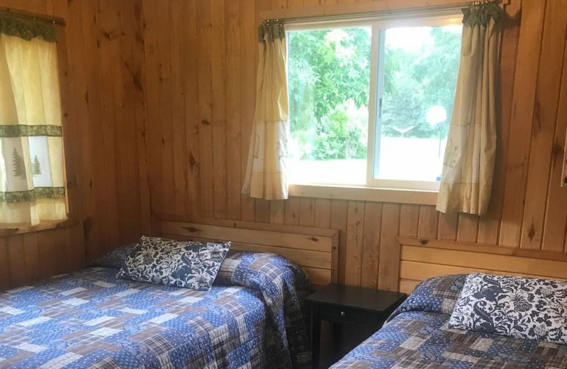 Cabin bedroom at Sandy Point Lodge.