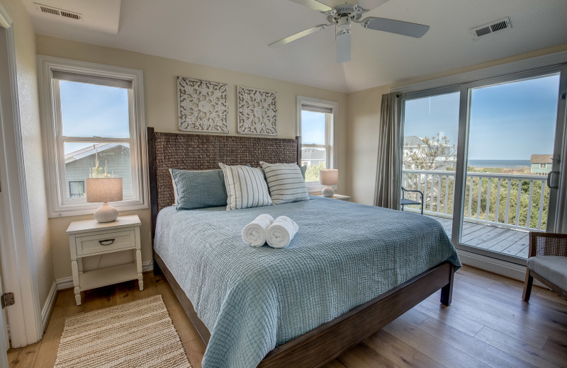 Rental bedroom at Sandbridge Blue Vacation Rentals.