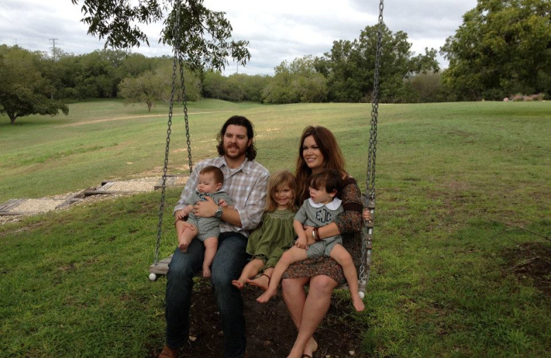 Family on swing at Haven River Inn.