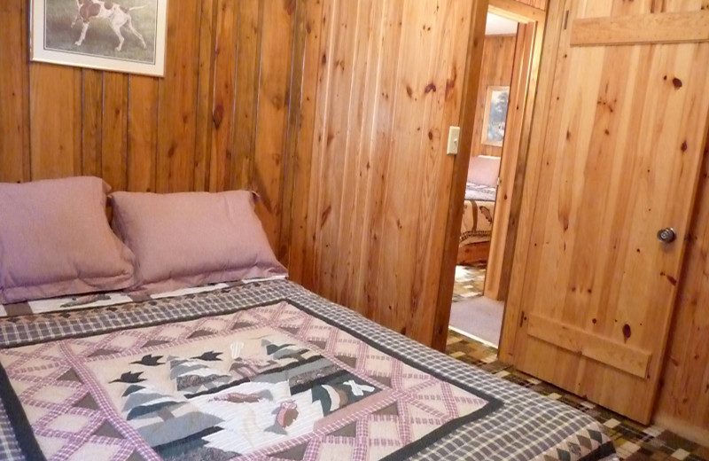 Cabin bedroom at Anderson's Starlight Bay Resort.