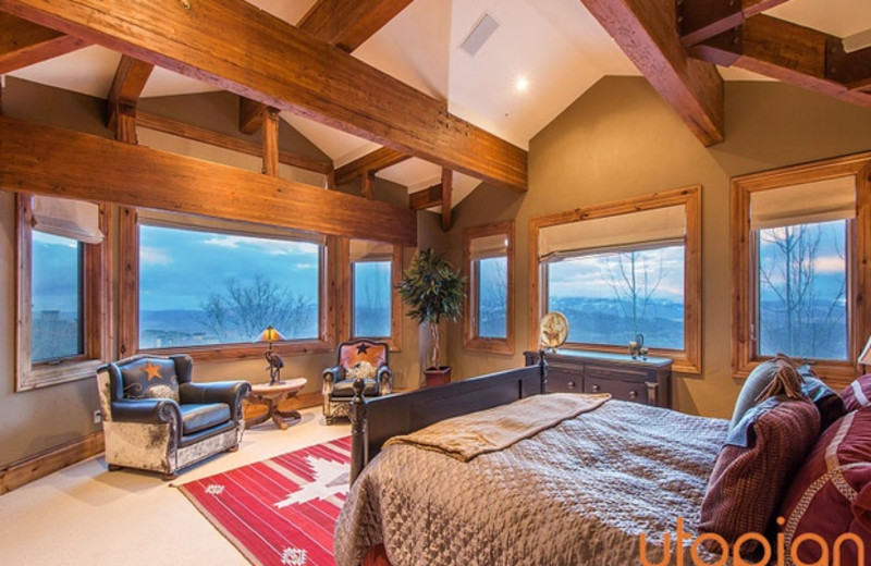 Rental bedroom at Utopian Luxury Vacation Homes.