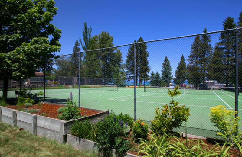 Tennis courts at Aston Lakeland Village.