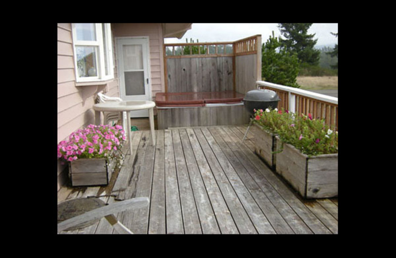Rental deck with hot tub at Manzanita Rental Company.