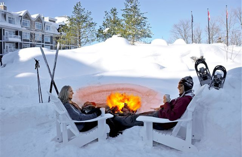 Relax by the bonfire at JW Marriott The Rosseau Muskoka Resort & Spa.