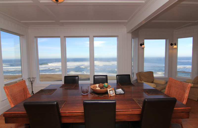 Vacation rental dining room at Beachfront Vacation Rentals.