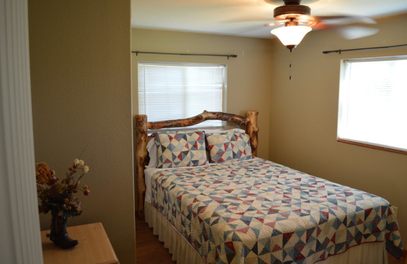 Cabin bedroom at Mulberry Mountain Lodging & Events.