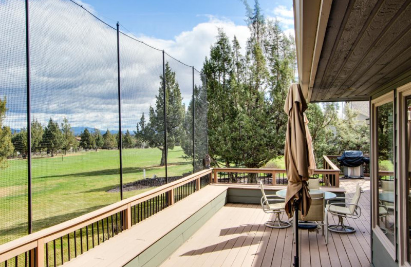 Vacation rental deck looking out on golf course at Vacasa Rentals Eagle Crest.