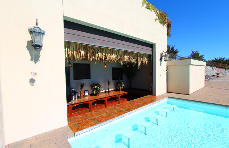 Poolside bar at D'Monaco Luxury Resort and Restaurant.