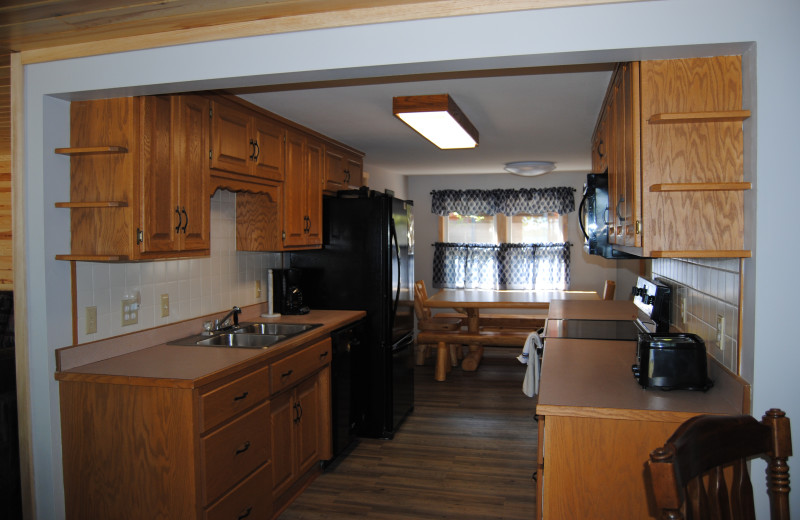 Cabin kitchen at Sandy Pines Resort.