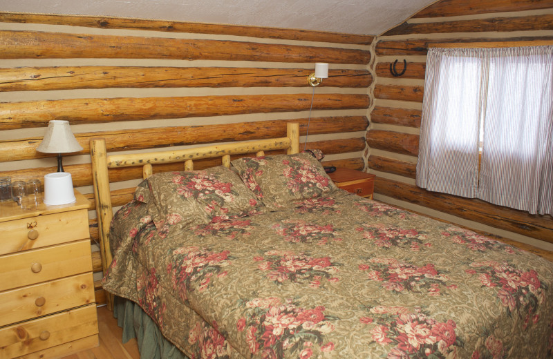 Cabin bedroom at Triangle X Ranch.