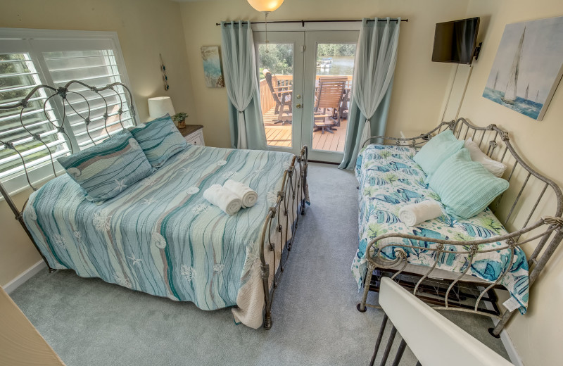 Rental bedroom at Sandbridge Blue Vacation Rentals.