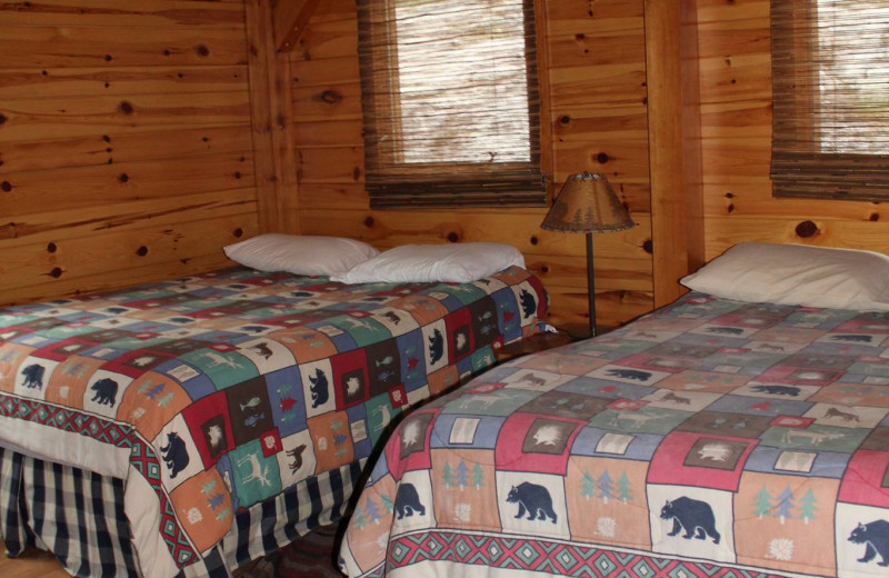 Cabin bedroom at Cliff Lake Resorts.