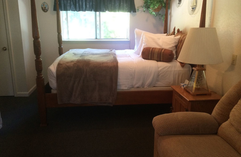 Cabin bedroom at Long Barn Lodge.