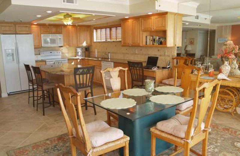 Vacation rental dining table and kitchen at Resort Rentals.