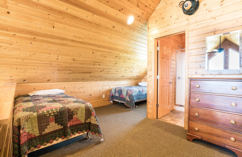 Cabin bedroom at Otter Tail Beach Resort.