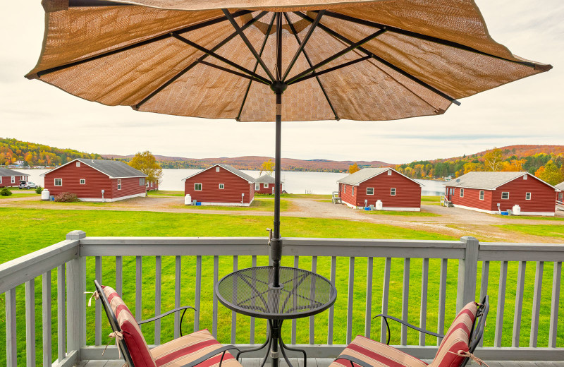 Wafarer rooms with wrought-iron patio furniture on deck at Jackson's Lodge and Log Cabin Village looking west to awesome sunsets.