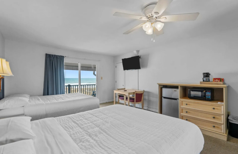 Guest room at Beach House Inn and Suites.