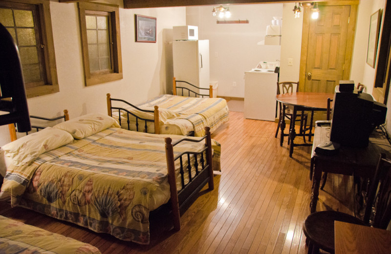 Cabin bedroom at Tri Lake Timbers Resort.