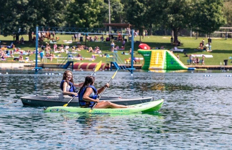 Paddle boarding at Yogi Bear's Jellystone Park Clay's Resort.