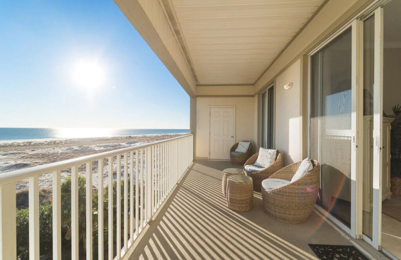 Rental balcony at Beachfront Rentals and Sales.