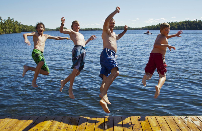 Kids jumping in lake at Severn Lodge.