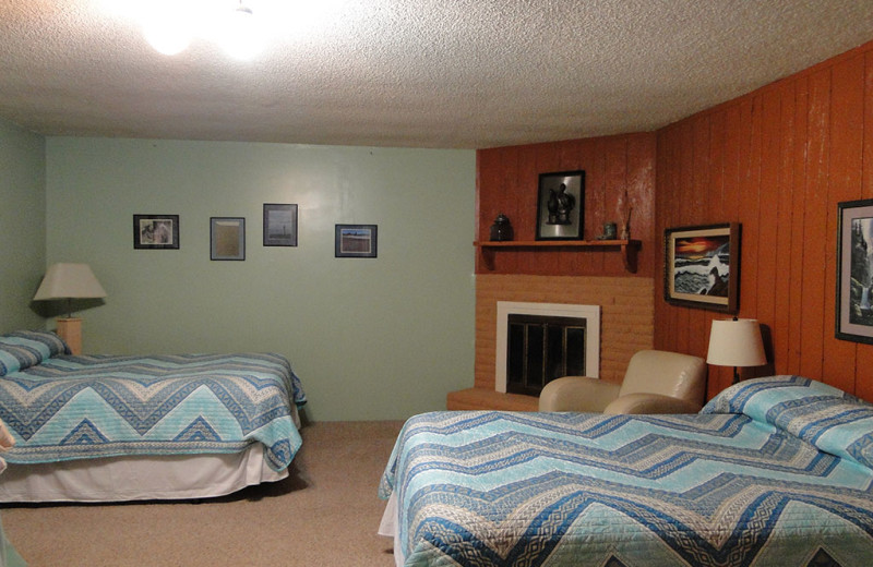 Cottage bedroom at Shakti Cove Cottages.