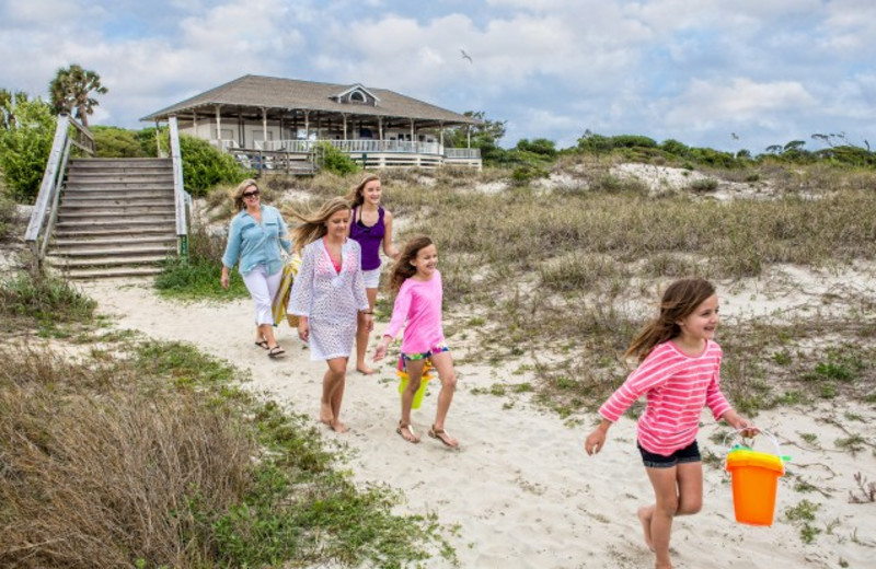 Family on beach at Jekyll Island Club Hotel.