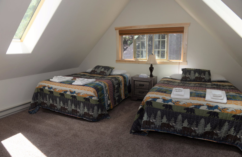 Cabin bedroom at Three Rivers Resort & Outfitting.