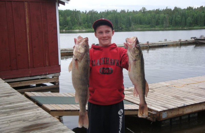 Fishing off the dock at Rex Tolton's Miles Bay Camp.