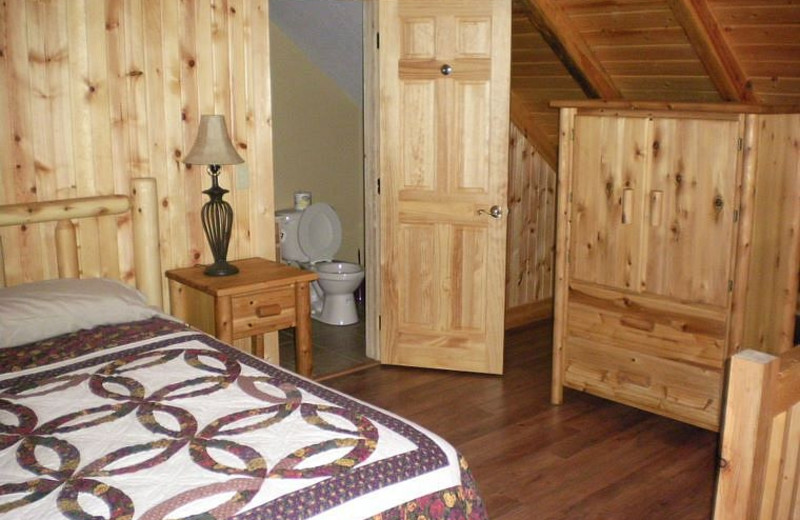 Cabin bedroom at Harman's Luxury Log Cabins.