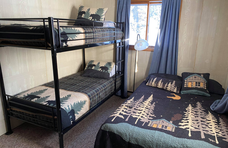 Cabin bedroom at Wilderness Bay Lodge and Resort.