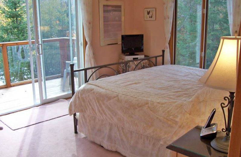 Cottage bedroom at All-Season Cottage Rentals.