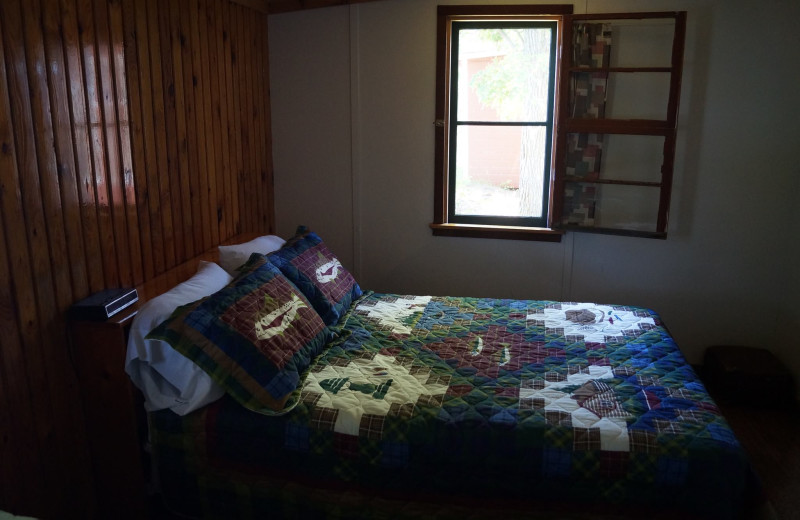 Cabin bedroom at Anderson's Starlight Bay Resort.