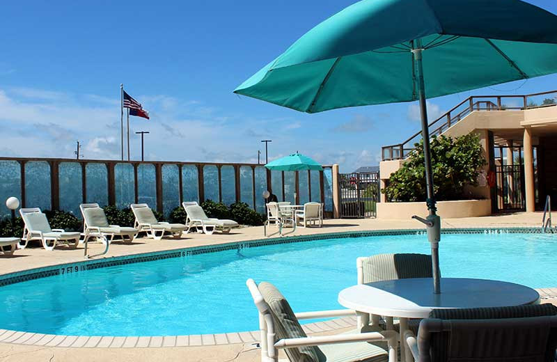 Outdoor pool at The Dunes Condominiums.