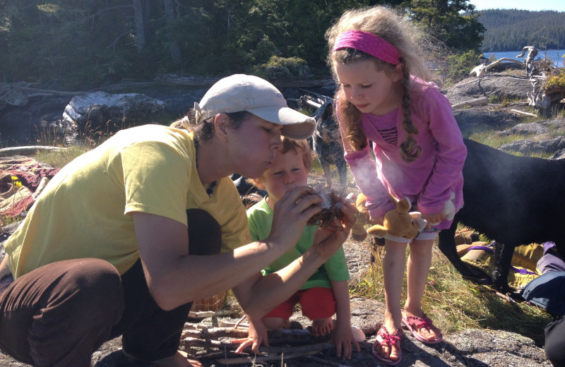 Starting a campfire at Blackfish Lodge.