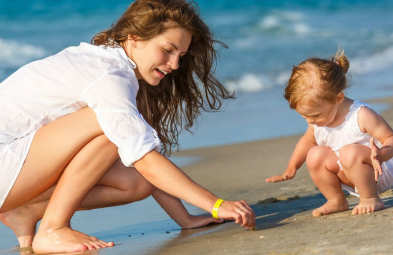 Family on beach at Croc's Resort & Casino.