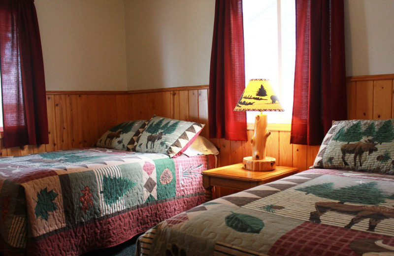 Cabin bedroom at Auger's Pine View Resort.