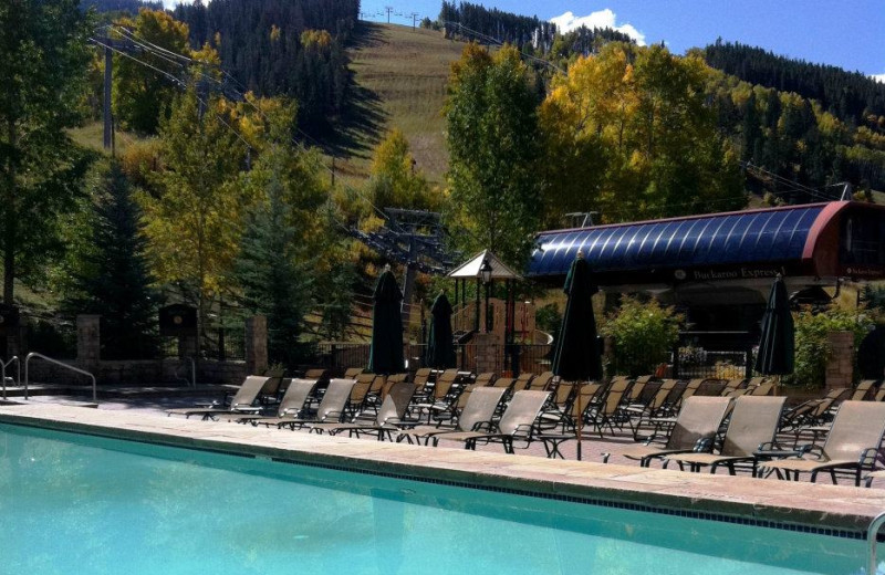 Relax by the pool at East West Resorts Beaver Creek.