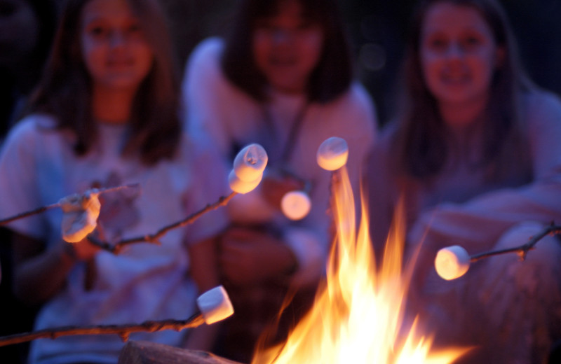 Group roasting marshmallows at Arrowwood Resort and Conference Center.