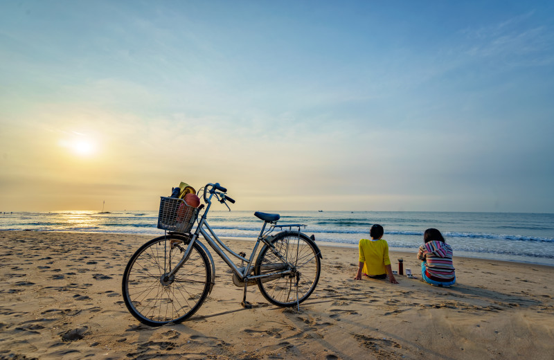 Couple on beach at Sea Star Realty.