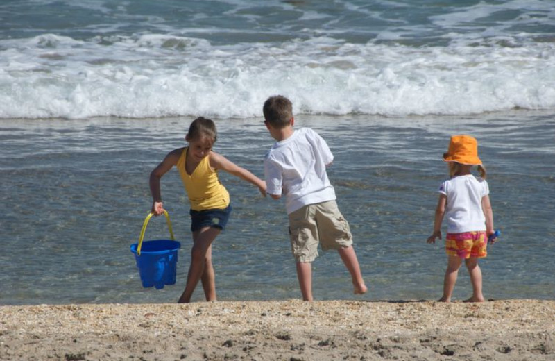 Kids on beach at Beach Vacation Rentals.