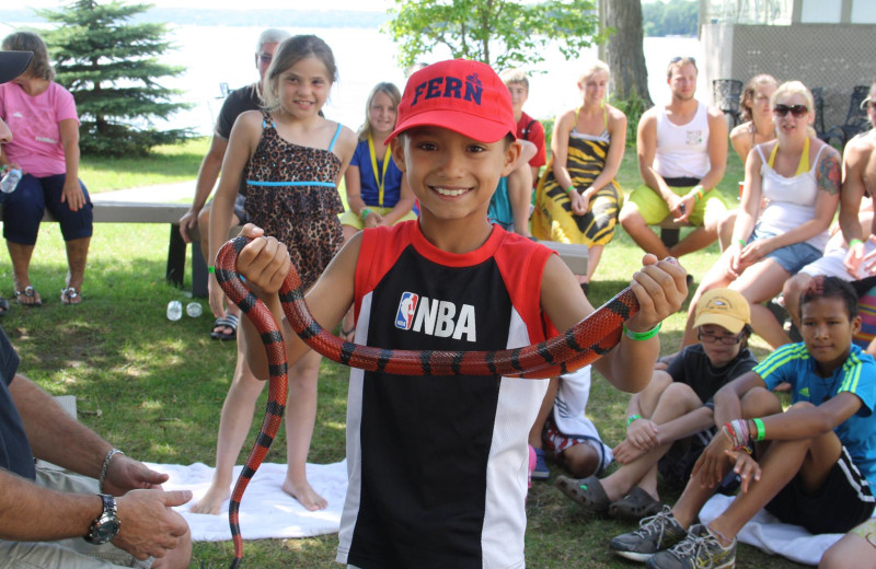 Boy holding snake at Fern Resort.