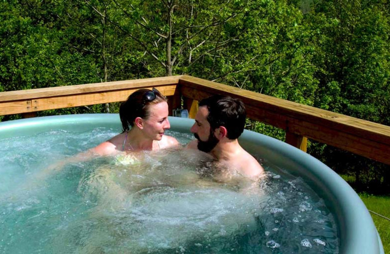 Couple in hot tub at Stone Wind Retreat.