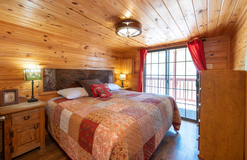 Cabin bedroom at Yogi Bear's Jellystone Park Wichita Falls.