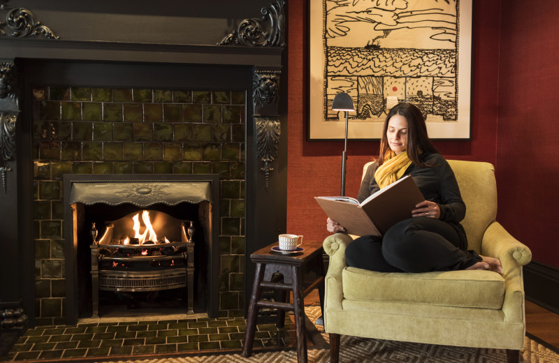 Relaxing by the fire at The Inns of Aurora.